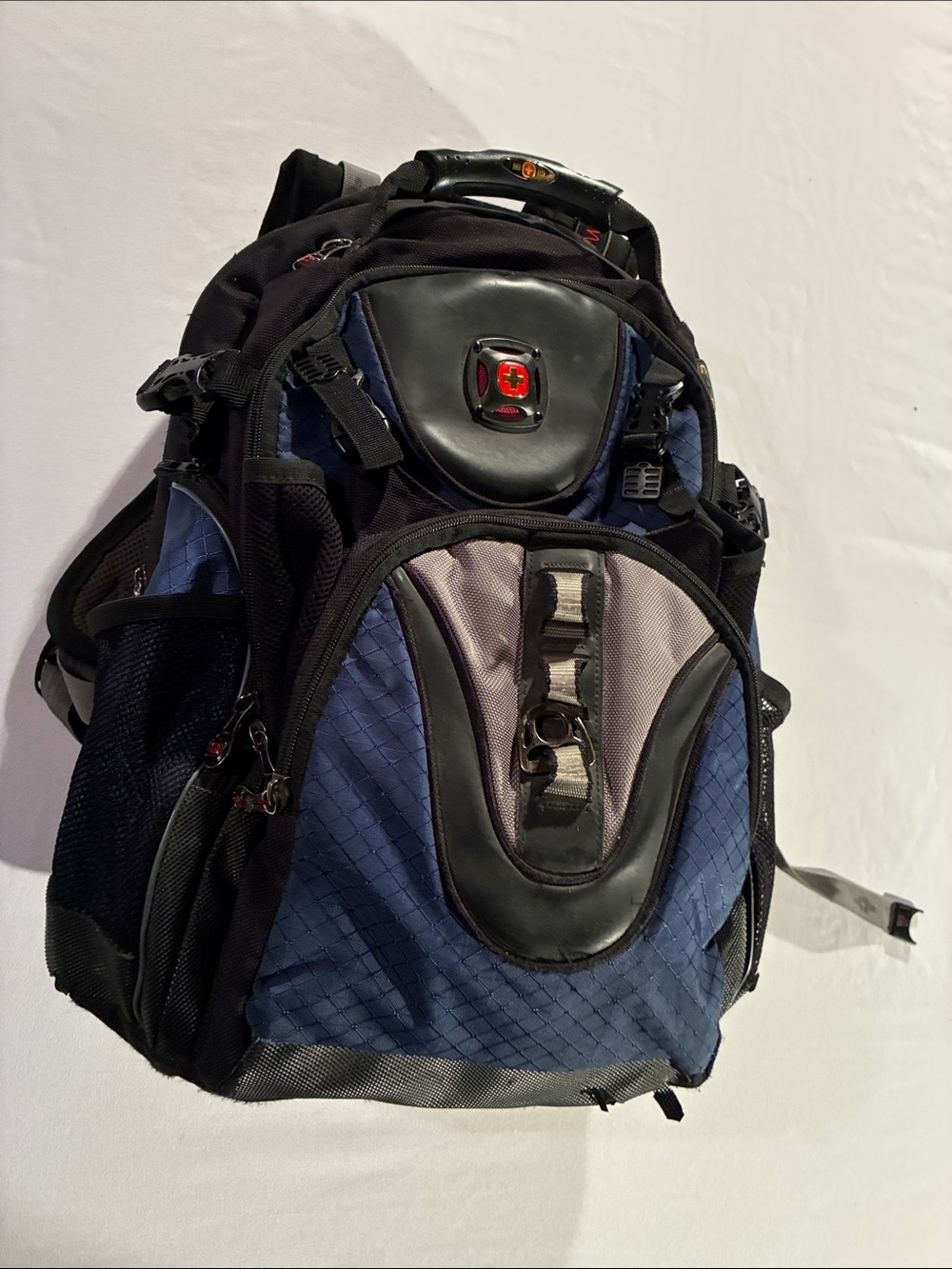SwissGear Men’s Blue and Black Backpack by Wenger
